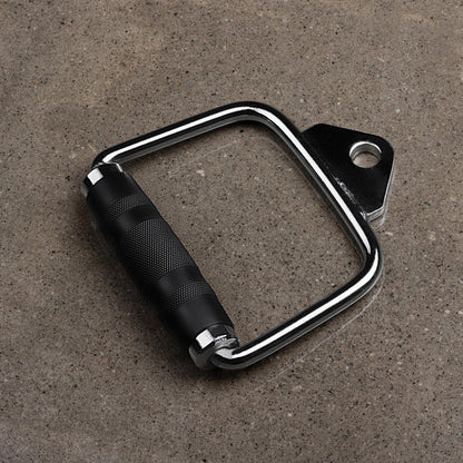 A BefitNow Canada Steel D Handles Pair, featuring a black and silver design with rubberized grips, sits on a gray concrete surface. These handles include metal rings for easy attachment to gym equipment, ideal for enhancing your cable machine workouts.