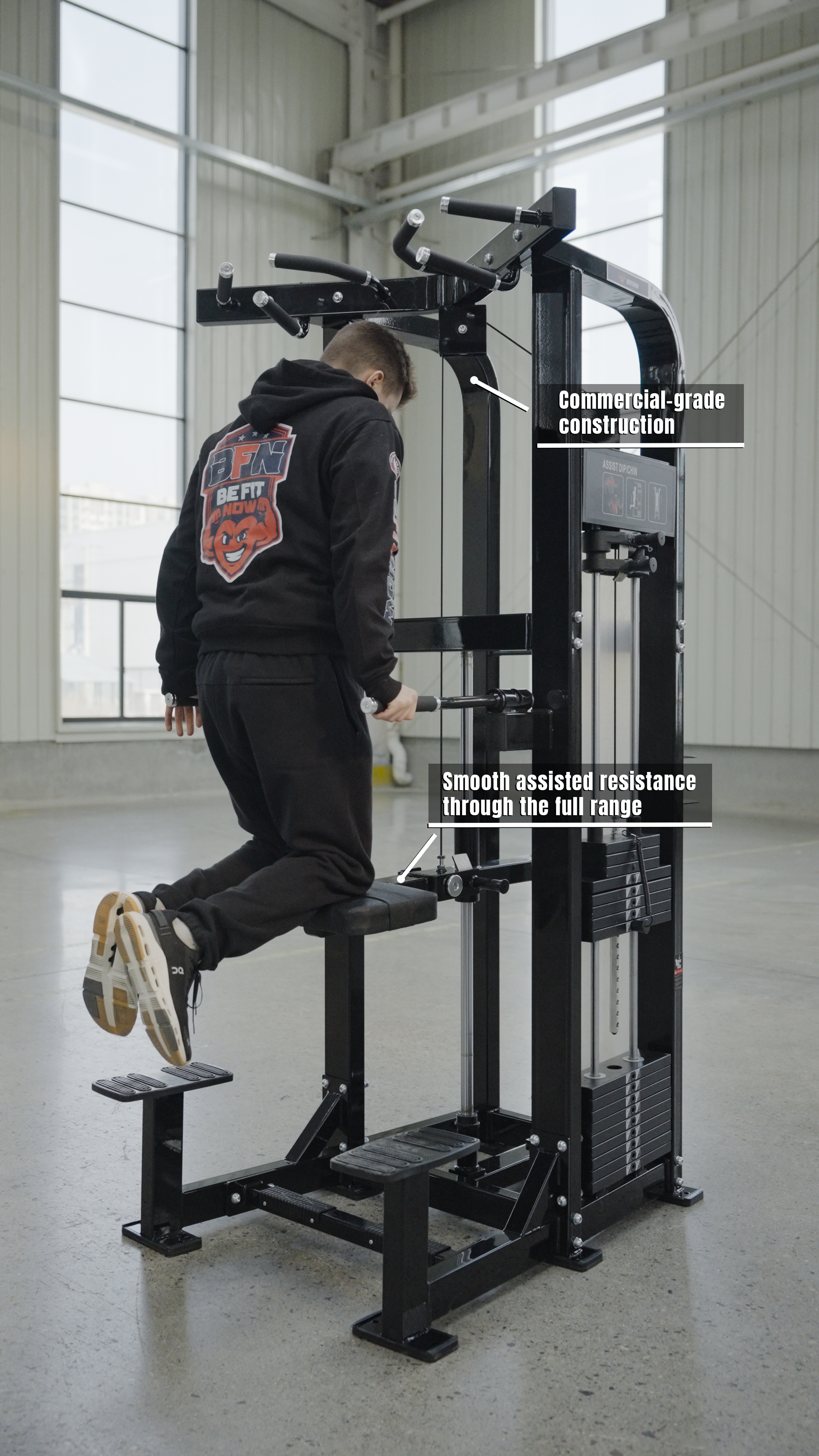 A person uses the BefitNow Canada Dip/Chin Assist machine in a bright gym, showcasing its commercial-grade build and smooth assisted resistance—ideal equipment for commercial gyms focused on full-range upper-body strength training.