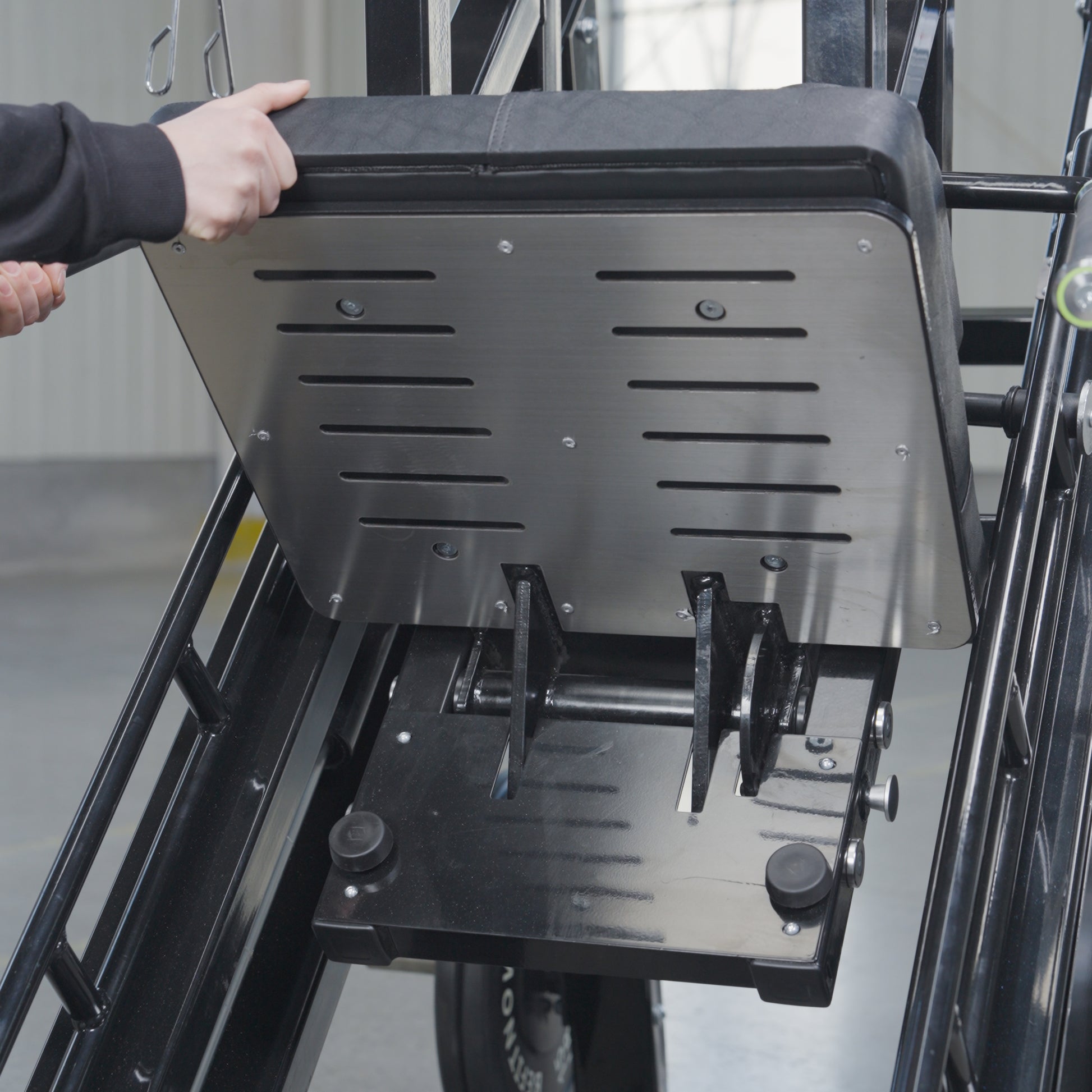 Someone using the BefitNow Canada 45 Degree Leg Press Hack Squat, which weighs 560 lbs.