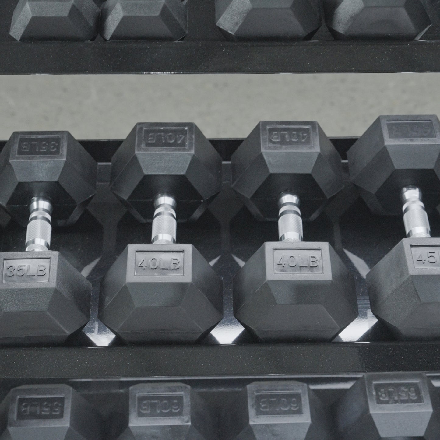 A close-up of BefitNow Canada’s 3 Tier Commercial Hex Dumbbell Rack, neatly holding hex dumbbells with visible weight markings such as 35 LB, 40 LB, and 45 LB.