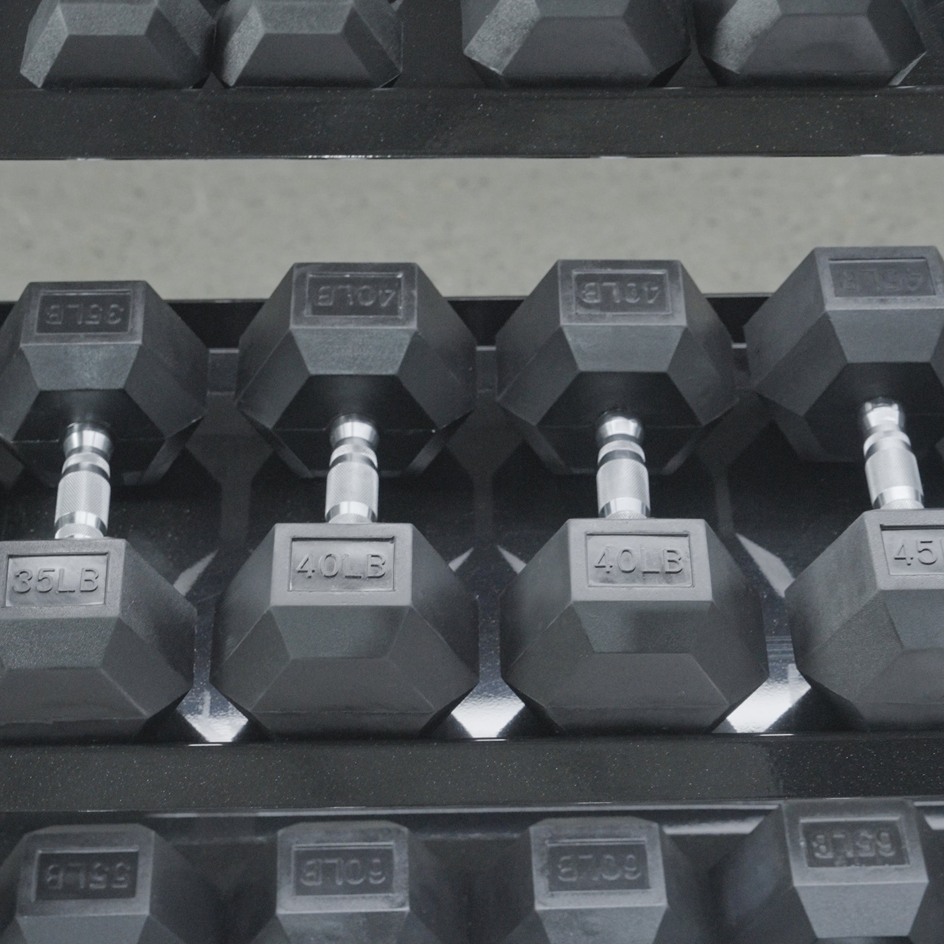 A close-up of BefitNow Canada’s 3 Tier Commercial Hex Dumbbell Rack, neatly holding hex dumbbells with visible weight markings such as 35 LB, 40 LB, and 45 LB.