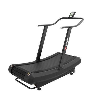 Introducing The Curve Reaper by BefitNow Canada—a black manual curved treadmill with sturdy handrails, a small front display, and a robust running deck. No motor. No mercy. Perfect for commercial cardio and indoor fitness training.
