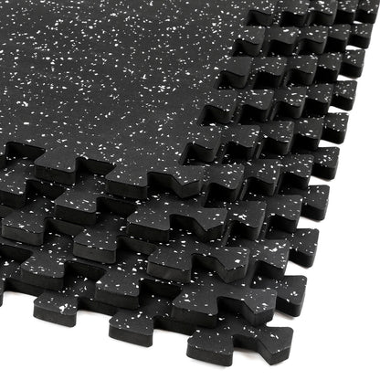 A row of interlocking BefitNow Canada 20mm Commercial Rubber Floor Mats features black foam with white speckles. Each mat has puzzle-like edges for easy connection, making them ideal for gym flooring or play areas. Crafted from recycled rubber, these mats offer a seamless, eco-friendly surface.