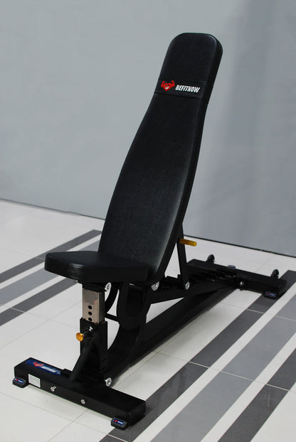 The BefitNow Canada TM87 Fully Adjustable Commercial Bench, perfect for gyms, comes in black and gray with a branded padded backrest and seat. It complements the light gray wall and tiled floor beautifully.